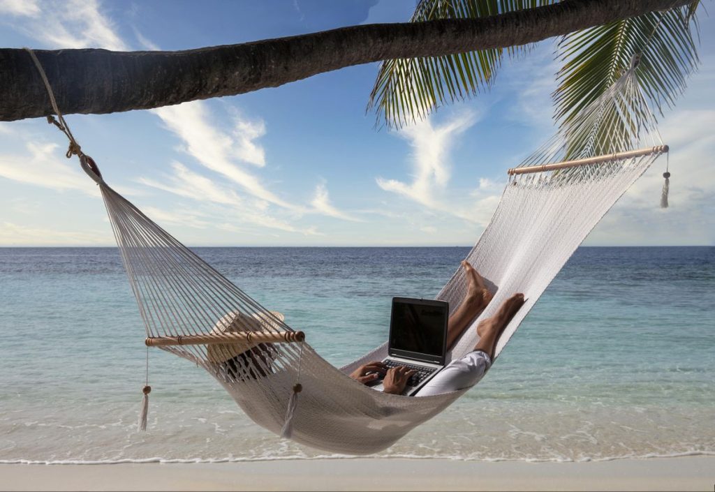 woman working in a hammock